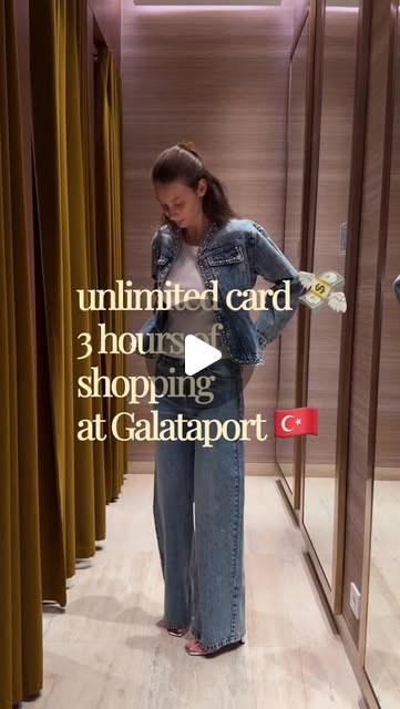 A creator walking a gold-lined shopping arcade at Galataport in Istanbul, carrying bags.